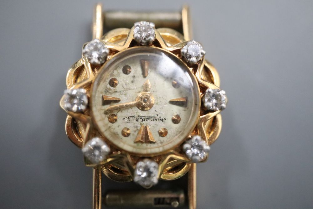 A ladys yellow metal and diamond set Jager LeCoultre manual wind wrist watch, diameter 16mm, gross 6.4 grams.